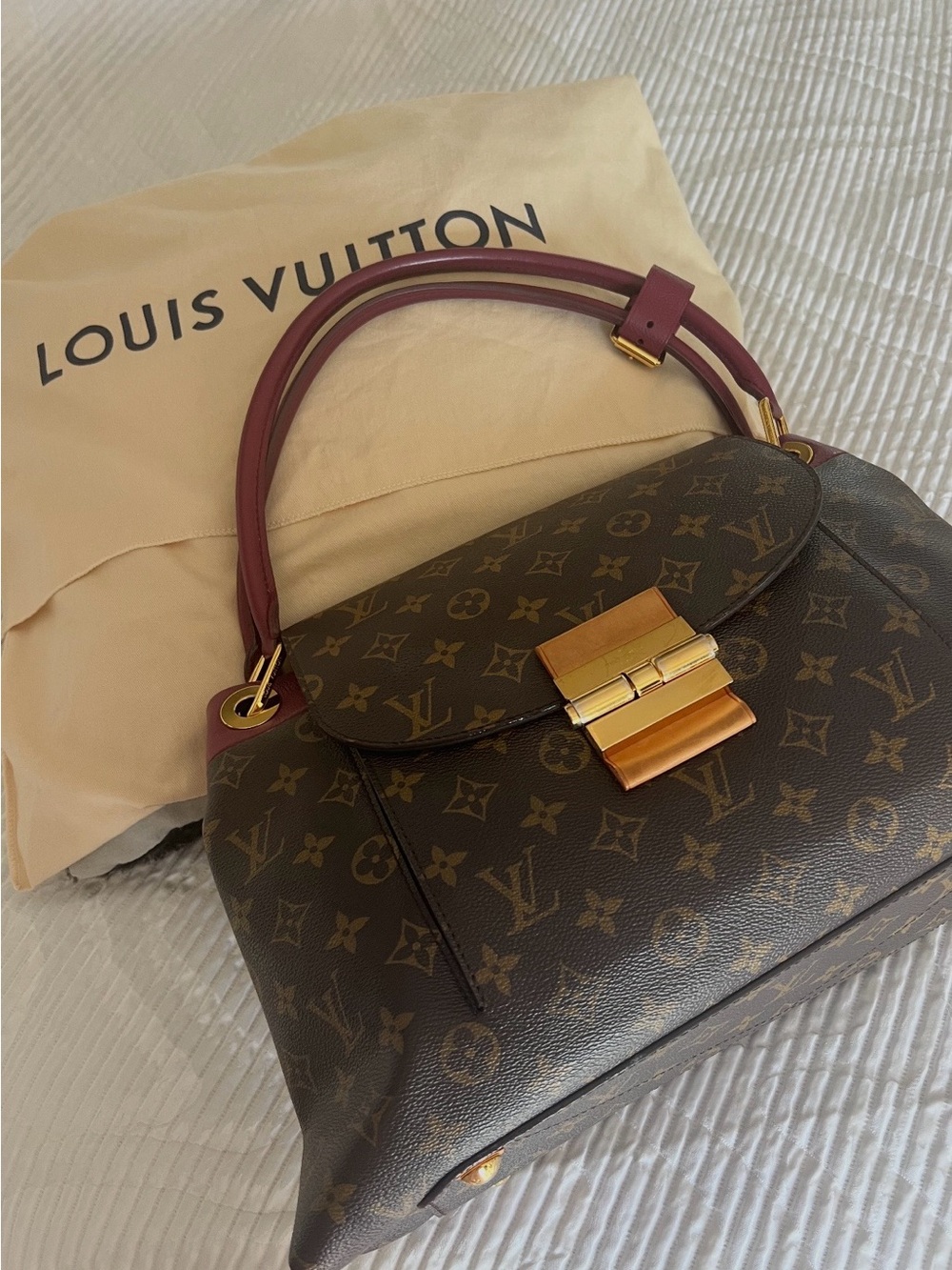 Louis Vuitton Brown Monogram Handbag with Burgundy Handles
